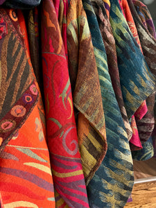 Colorful patterned fabric hanging on a rack